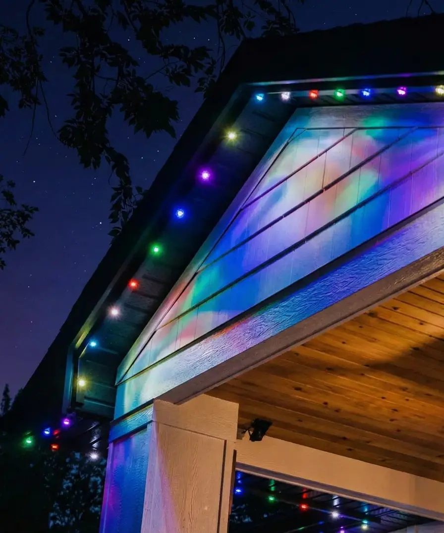 Home with their permanent outdoor lighting on in multiple colors.